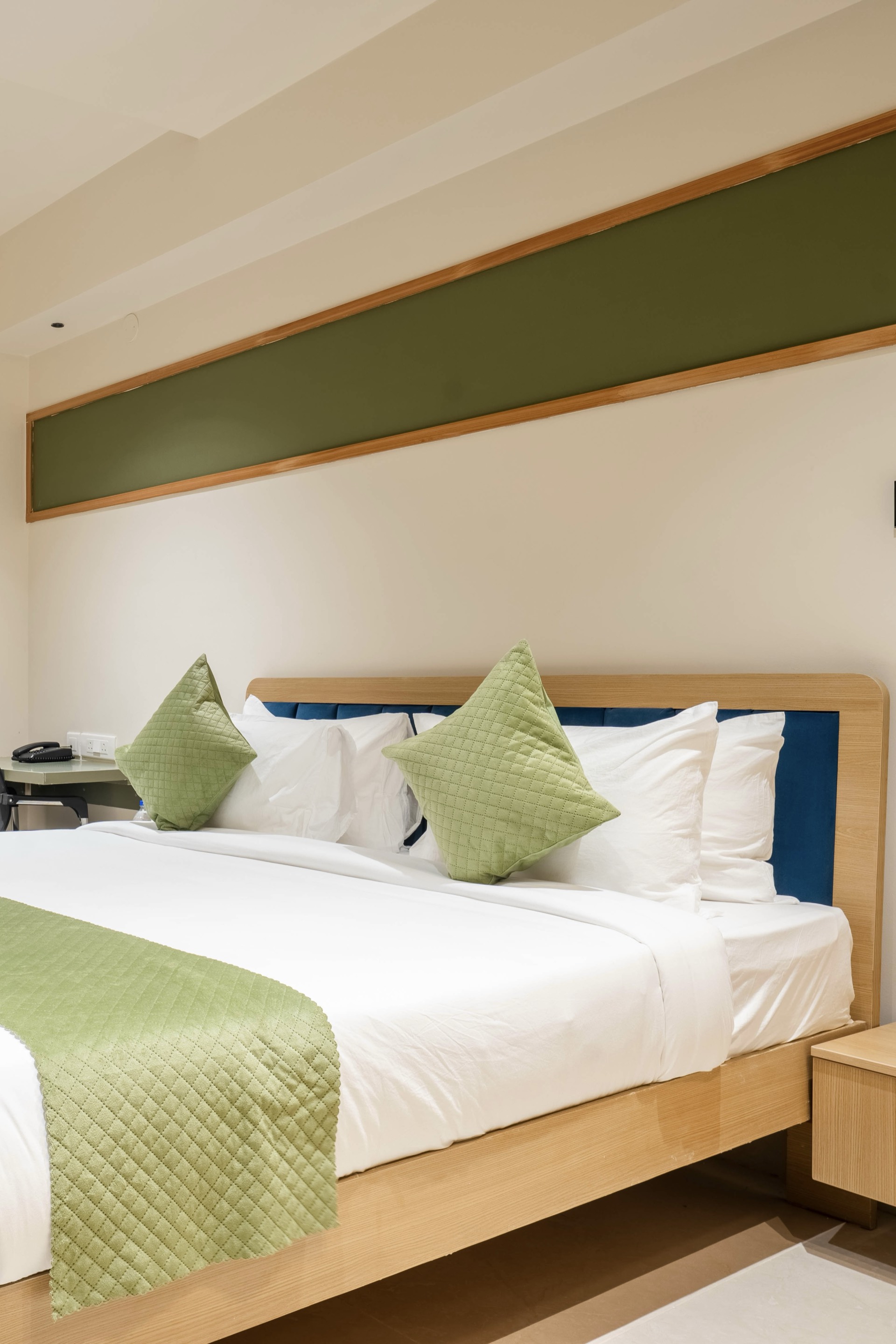 Cozy hotel bedroom with plush bedding